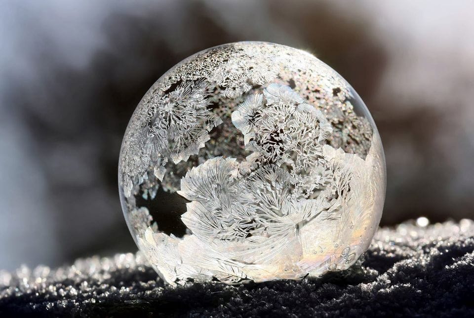Frost crystals forming over a bubble