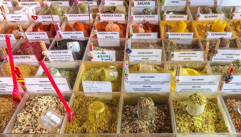 Rows of spices and dried herbs in labelled trays