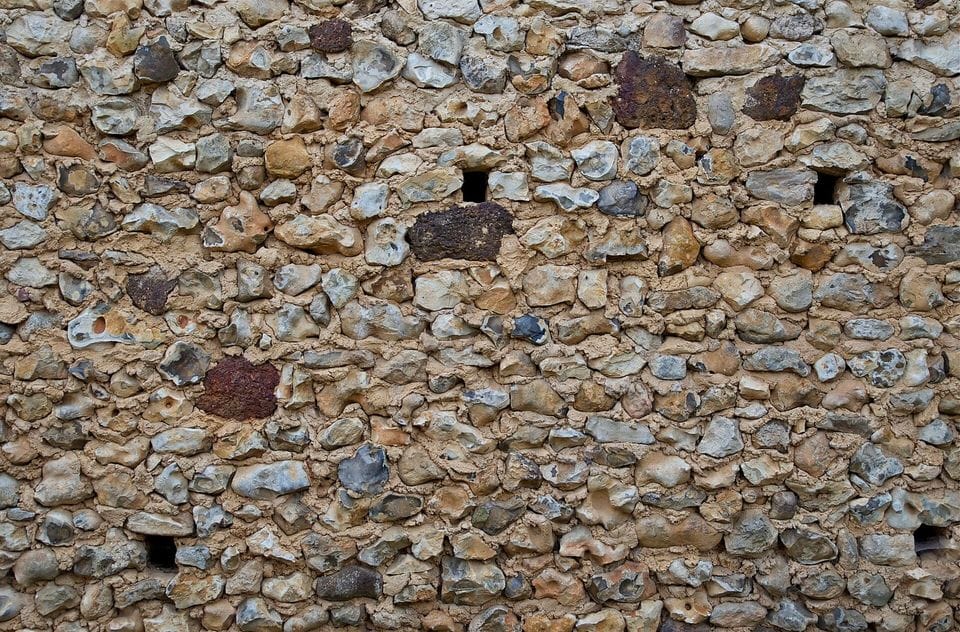 Rough wall of mixed pebbles and small stones
